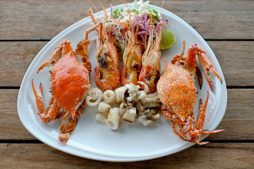 seafood of Grilled on wooden table at the beach