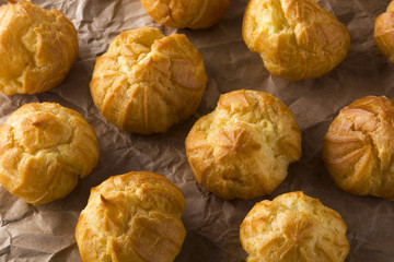 Delicious eclairs with cream. Top view, close up.
