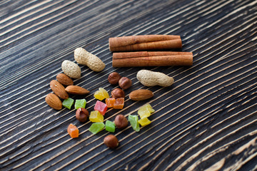 Chips of chocolate and nuts on textured board