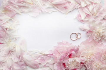 wedding background with peonies and rings for invitations and cards