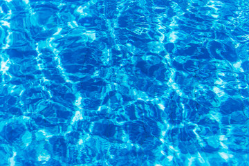 Hotel swimming pool with sunny reflections