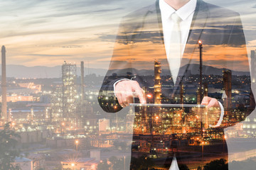 Double exposure of businessman hand hold tablet