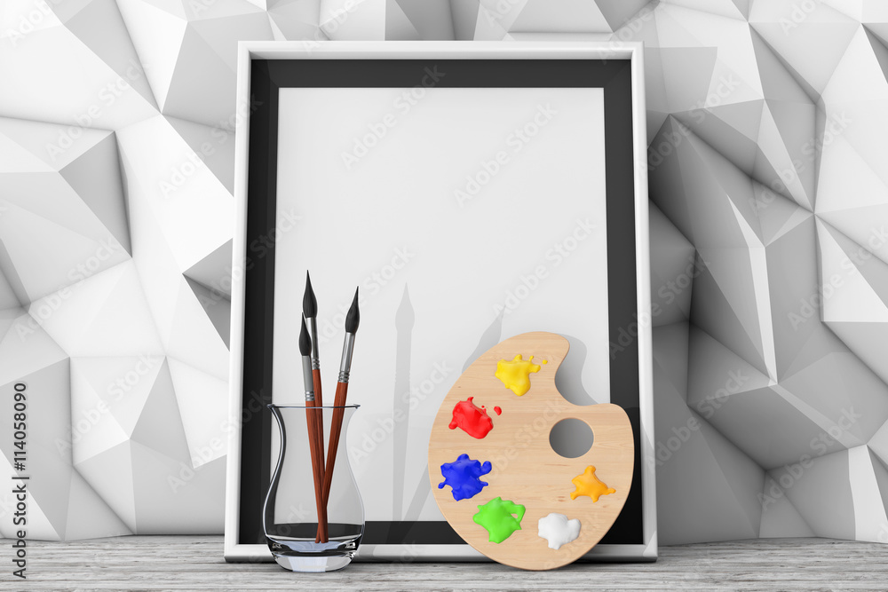 Poster blank picture frame with paintbrushes and pallette in front of l