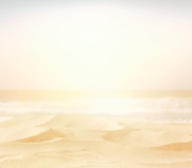 Fototapeta na wymiar Abstract blurry high key image of empty sand beach