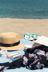 Typical beach gear of beauty products and care with female things for day in summer