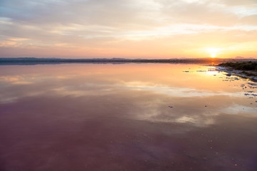 Colorful lake down the orange sunset