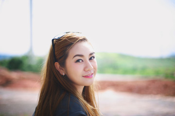 Smile face Asian girl outdoor portrait.