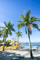 Typical Brazilian beach kiosk nestled in palm trees on the boardwalk at Ipanema Beach in Rio de Janeiro, Brazil