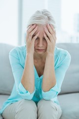 Senior woman suffering from headache