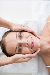 Fototapeta na wymiar Cropped hands of masseur massaging woman