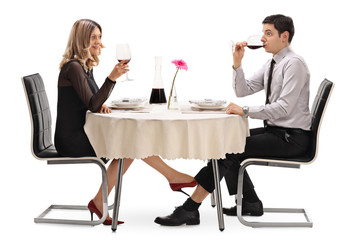 Woman touching a man under the table