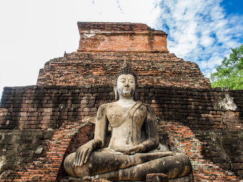 An ancient buddha statue at Mahathat Temple in Sukhothai Historical Park, Sukhothai, Thailand. 
