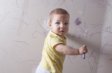 Baby boy scrawling writing
