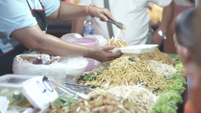 Street Vendor Sell and Packaging Stir Fried Pad Thai Noodle, Kata Road, Phuket, Thailand