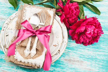 Tableware and silverware with peonies