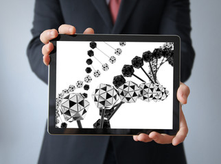 businessman with dna on a tablet
