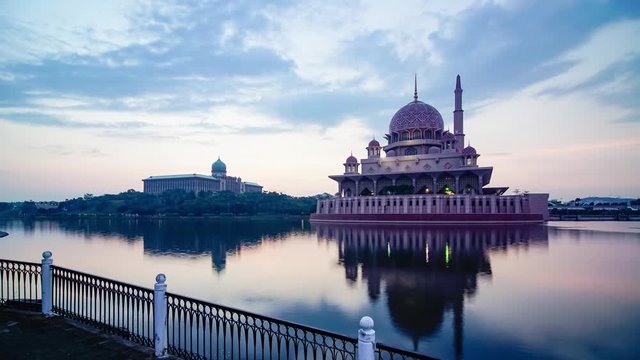 Time lapse of Putra Mosque in Putrajaya, Malaysia at sunrise by the lakeside with 4K video resolution.