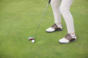 Obraz premium Low section of woman playing golf 