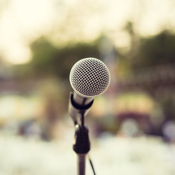 Microphone on outdoor stage. Vintage filter