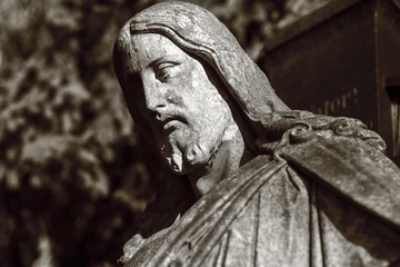 black and white shot of a jesus sculpture