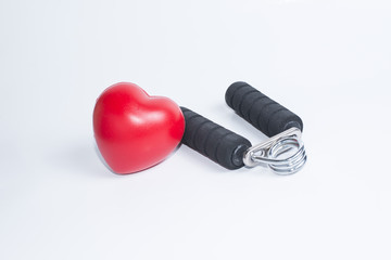 Fitness background with bottle of handgrip and heart