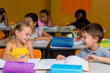 Classmates laughing in classroom