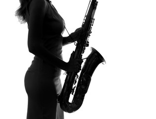 Fototapeta premium young woman playing the saxophone