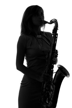 Young Woman Playing The Saxophone