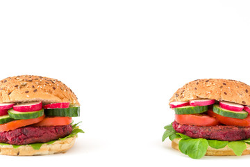 Vegan beetroot burger with lamb's lettuce, tomato, cucumber and radish isolated on white background

