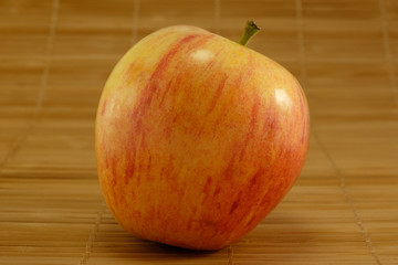 Apple on grille bamboo background