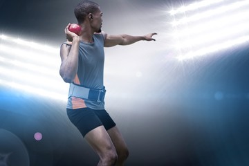 Composite image of rear view of sportsman practising shot put  © vectorfusionart