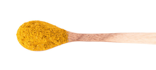 Heap of curry powder, closeup, isolated on white background.