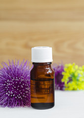 Small bottle of burdock extract (oil, tincture, infusion)