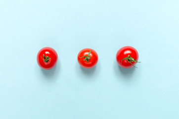 Cherry tomatoes on a blue background