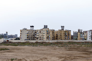 Old and weathered apartments houses in Egypt.