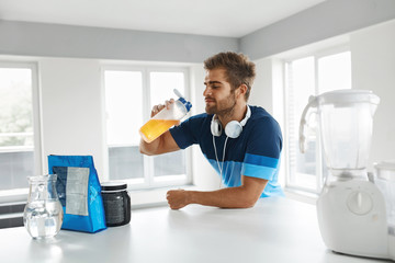 Man Drinking Sports Drink Before Training. Nutrition Supplements