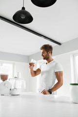 Nutrition Supplements. Man Drinking Protein Shake Before Workout