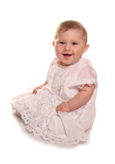 baby girl in a christening gown