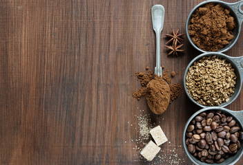 Different types of coffee on a wooden background