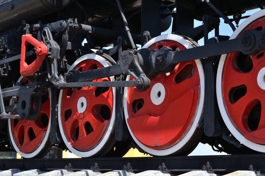 The wheels of the locomotive.
The wheels of the locomotive standing on rails. Close-up