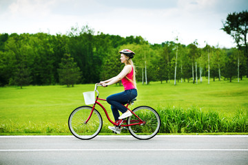 Obraz premium .young girl riding a bicycle in a park
