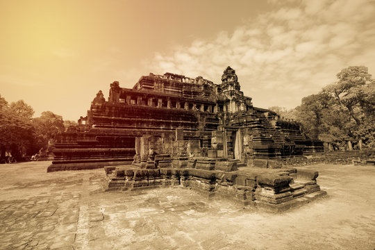 Ancient angor thom castle in cambodia. Vintage filter