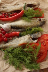 River trout baked with vegetables on baking paper.