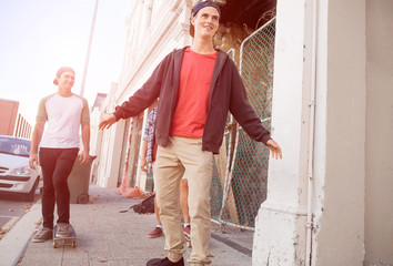 Guys skateboarders in street