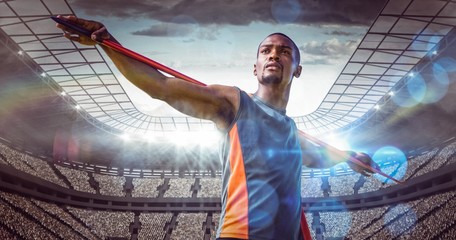 Composite image of sportsman is practising javelin throw 