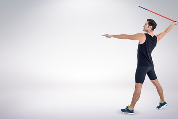 Composite image of male athlete preparing to throw javelin