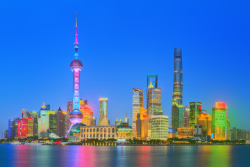 Beautiful night Shanghai's cityscape with the city lights on the Huangpu River, Shanghai, China.