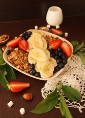 granola with banana, strawberry and blueberry for a healthy breakfast 