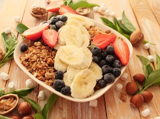 granola with banana, strawberry and blueberry for a healthy breakfast 