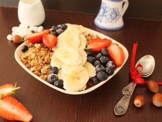 granola with banana, strawberry and blueberry for a healthy breakfast 